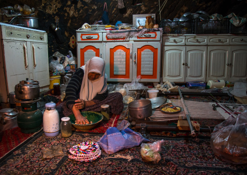 old widow woman in her troglodyte house, Kerman province, Meymand, Iran
