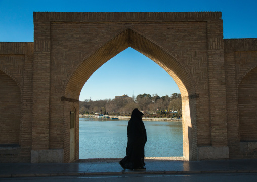 women passing in front of a bridge arch, Isfahan Province, isfahan, Iran