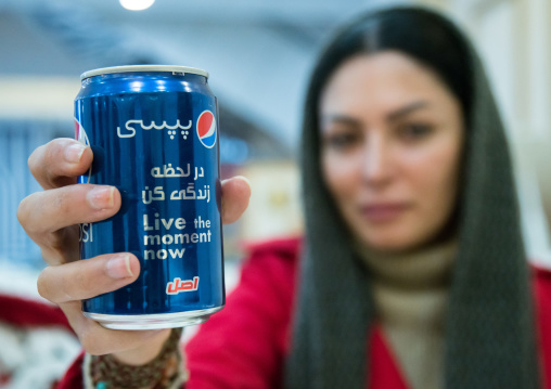 iranian woman showing a pepsi can with persian script, Isfahan Province, isfahan, Iran