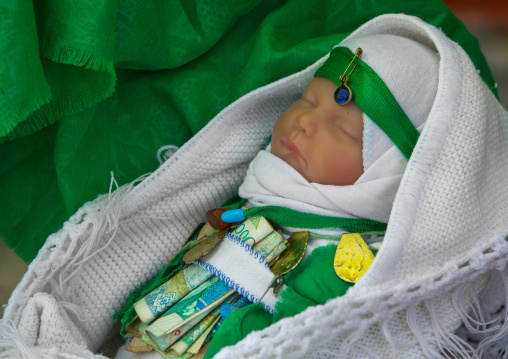 A Baby Doll With Bank Notes Attached On His Belt During Tasua Celebrations One Day Before Ashura, Lorestan Province, Khorramabad, Iran