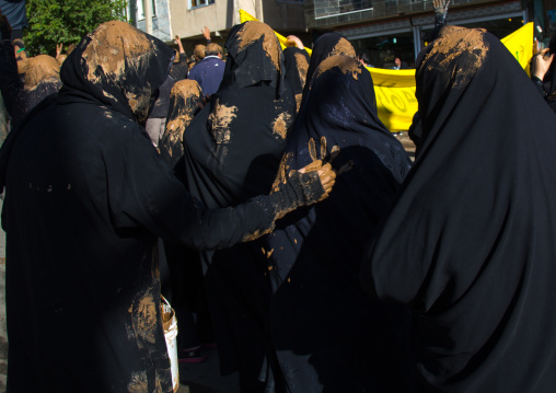 Iranian Shiite Muslim Women Covered In Mud, Chanting And Self-flagellating During Ashura, The Day Of The Death Of Imam Hussein, Kurdistan Province, Bijar, Iran