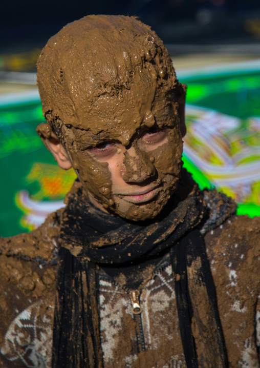 Iranian Shiite Muslim Boy Covered In Mud During Ashura, The Day Of The Death Of Imam Hussein, Kurdistan Province, Bijar, Iran