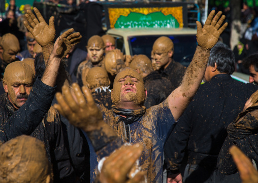 Iranian Shiite Muslim Men Covered In Mud, Chanting And Self-flagellating During Ashura, The Day Of The Death Of Imam Hussein, Kurdistan Province, Bijar, Iran