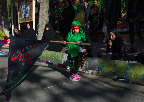 Iranian Shiite Girl With A Flag On Ashura, The Day Of The Death Of Imam Hussein, Kurdistan Province, Bijar, Iran