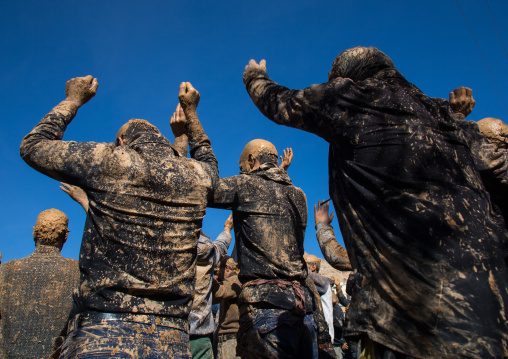 Iranian Shiite Muslim Men Covered In Mud, Chanting And Self-flagellating During Ashura, The Day Of The Death Of Imam Hussein, Kurdistan Province, Bijar, Iran