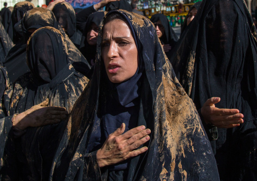 Iranian Shiite Muslim Woman Covered In Mud With Her Hand On Her Heart During Ashura, The Day Of The Death Of Imam Hussein, Kurdistan Province, Bijar, Iran