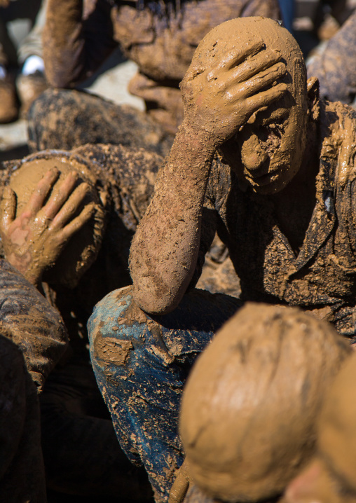 Iranian Shiite Muslim Men Covered In Mud Crying Together During Ashura, The Day Of The Death Of Imam Hussein, Kurdistan Province, Bijar, Iran