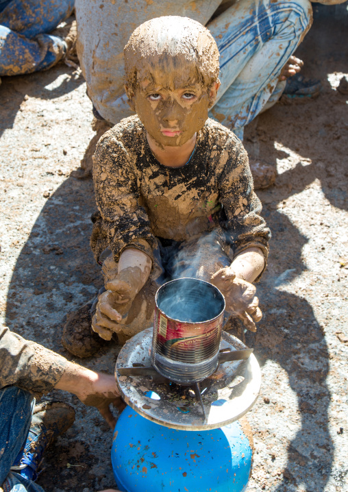 Iranian Shiite Muslim Boy Covered In Mud Searching For Heat During Ashura Day, Kurdistan Province, Bijar, Iran