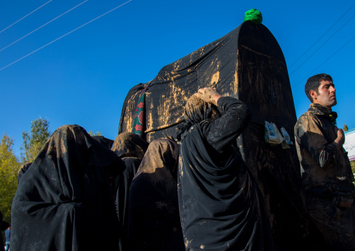 Iranian Shiite Muslim Women Covered In Mud Carrying A Coffin During Ashura, The Day Of The Death Of Imam Hussein, Kurdistan Province, Bijar, Iran