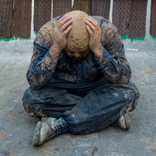 Iranian Shiite Muslim Man Covered In Mud Crying During Ashura Day, Kurdistan Province, Bijar, Iran