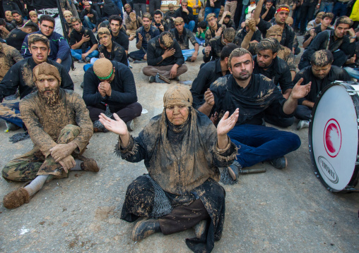 Iranian Shiite Muslim Woman Covered In Mud Praying In The Middle Of Men During Ashura Day, Kurdistan Province, Bijar, Iran