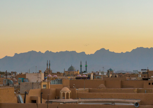 View Of The City With Traditional Wind Catchers And Mosques At Dusk, Yazd Province, Yazd, Iran
