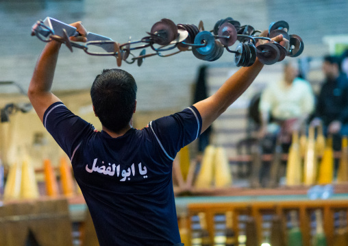 Iranian Man Training With Kabbadeh Chain And Bow At Saheb A Zaman Club Zurkhaneh, Yazd Province, Yazd, Iran