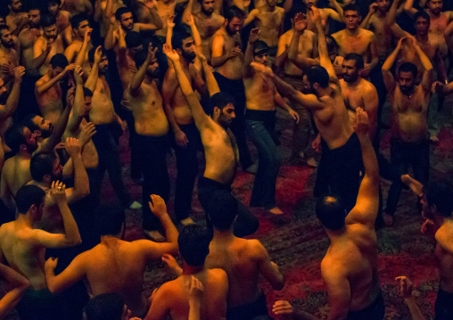 Iranian Shiite Muslim Mourners From The Mad Of Hussein Community Chanting And Self-flagellating During Muharram, Isfahan Province, Kashan, Iran