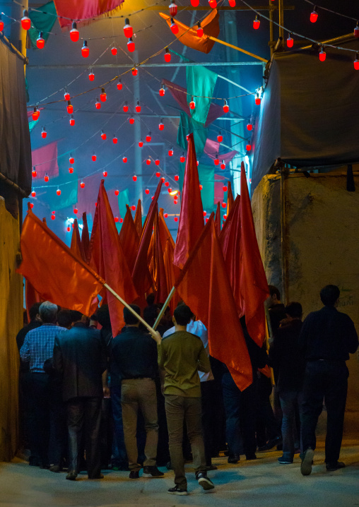 Iranian Shiite Muslims Men Parading With Red Flags During Ashura, The Day Of The Death Of Imam Hussein, Isfahan Province, Kashan, Iran
