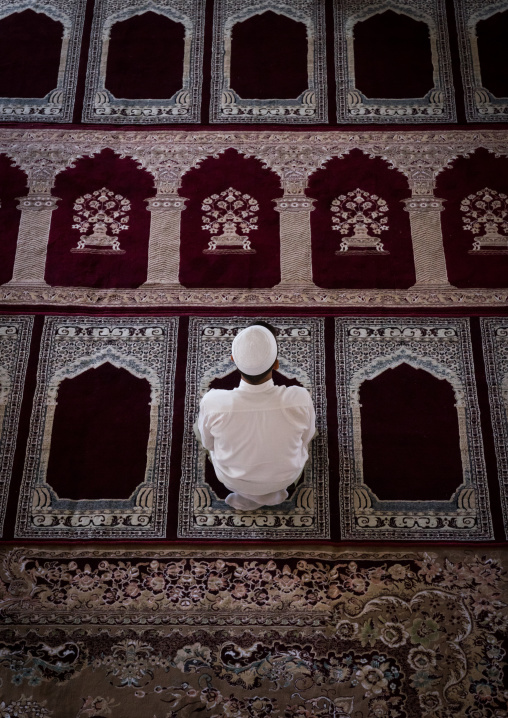 Iranian Shiite Muslim Prayer Sits On A Carpet In A Mosque, Golestan Province, Karim Ishan, Iran