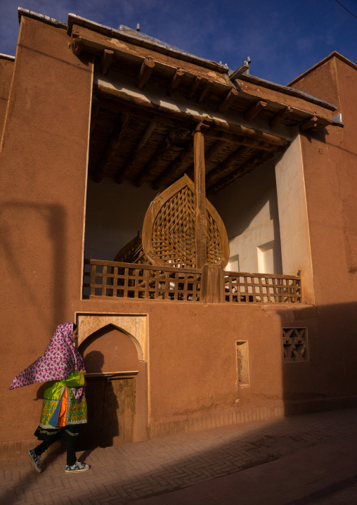 Woman Passing In Front Of A Nakhl In An Ancient Building In Zoroastrian Village, Isfahan Province, Abyaneh, Iran