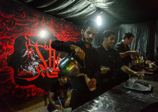 Iranian Shiite Muslim People Serving Nazri Hot Milk Distributed Freely To Mourners During Muharram, Isfahan Province, Kashan, Iran