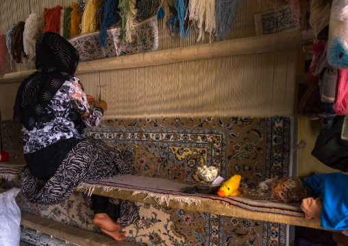 An Afghan Refugee Woman Making A Carpet In Her House, Isfahan Province, Kashan, Iran