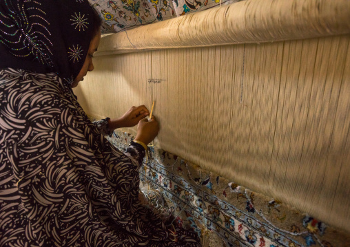 An Afghan Refugee Woman Making A Carpet In Her House, Isfahan Province, Kashan, Iran