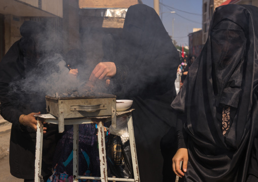 Shia Muslim Women Lighting Incense During Chehel Menbari Festival On Tasua Day For Ashura Celebration, Lorestan Province, Khorramabad, Iran
