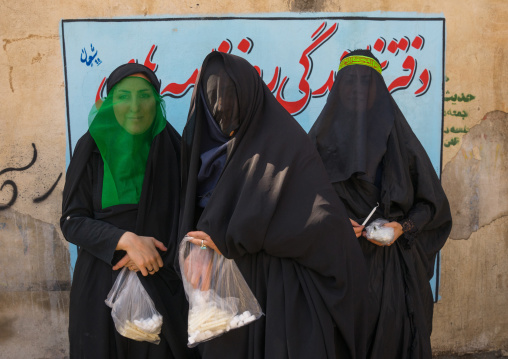 Shiite Muslim Women Mourning Imam Hussein On The Day Of Tasua With Their Faces Covered By A Veil, Lorestan Province, Khorramabad, Iran