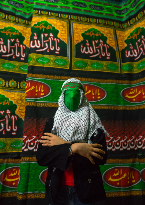 Iranian Young Man With Green Veil Covering His Face During Chehel Menbari Festival On Tasua To Commemorate The Martyrdom Of Hussein, Lorestan Province, Khorramabad, Iran