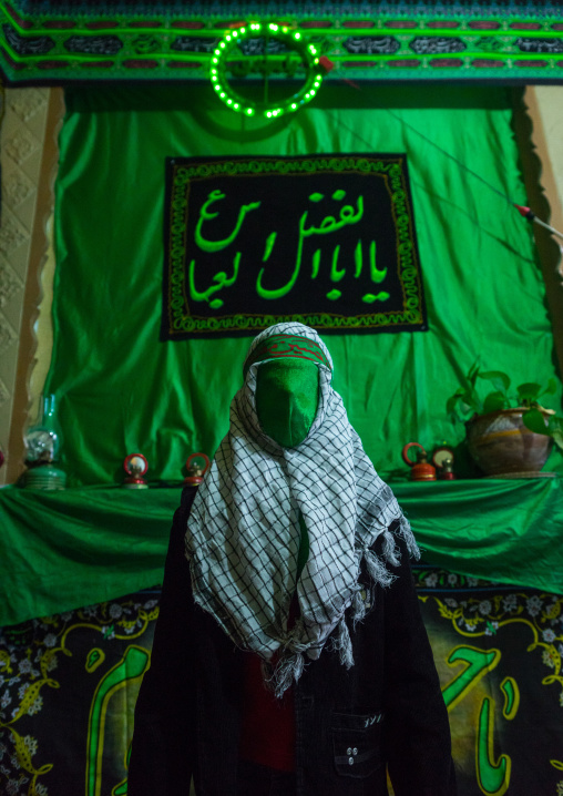 Iranian Young Man With Green Veil Covering His Face During Chehel Menbari Festival On Tasua To Commemorate The Martyrdom Of Hussein, Lorestan Province, Khorramabad, Iran