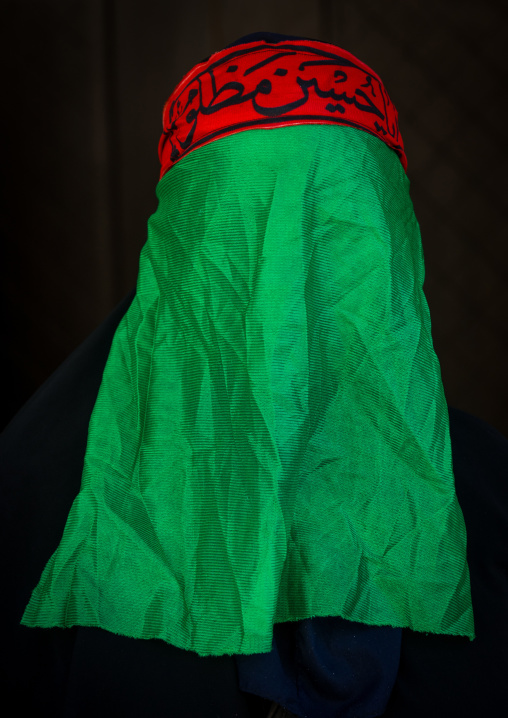 Iranian Shiite Muslim Woman Mourning Imam Hussein On The Day Of Tasua With Her Face Covered By A Green Veil, Lorestan Province, Khorramabad, Iran