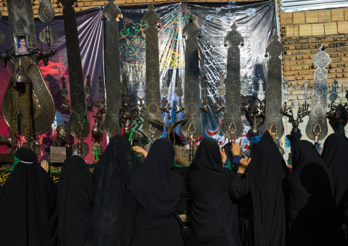 Iranian Shiite Women Putting Green Ribbons On An Alam To Make Wishes During Chehel Menbari Festival On Tasua Day, Lorestan Province, Khorramabad, Iran