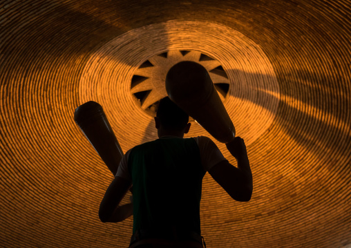 Iranian Man Wielding Wooden Clubs During The Traditional Sport Of Zurkhaneh, Yazd Province, Yazd, Iran
