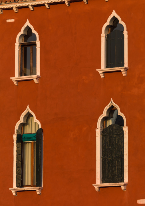 Venetian windows on a red historic house, Veneto Region, Venice, Italy