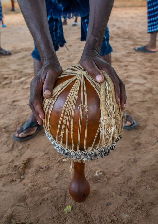 Musician with a shaker performing during a Goli sacred mask dance in Baule tribe, Région des Lacs, Bomizanbo, Ivory Coast