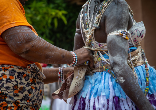 Women dressing for a ceremony in Adjoua Messouma Komians initiation centre, Moyen-Comoé, Aniassue, Ivory Coast