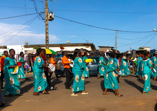 African women in the street dressed in the same way for a political rally, Sud-Comoé, Grand-Bassam, Ivory Coast