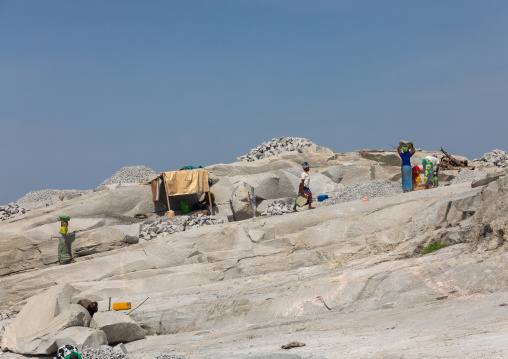 African people working in a granite quarry, Savanes district, Shienlow, Ivory Coast