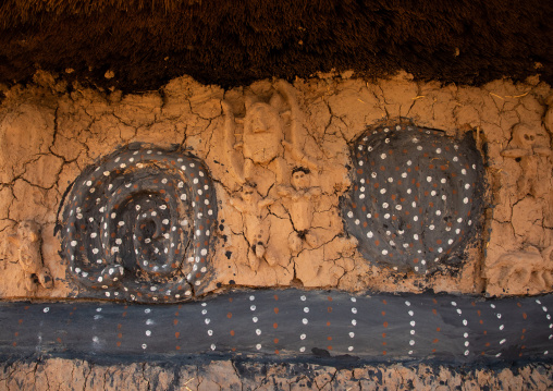 Snake on the muddy wall of a Senufo fetish house, Savanes district, Niofoin, Ivory Coast