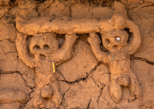 Human representation on the muddy wall of a Senufo fetish house, Savanes district, Niofoin, Ivory Coast