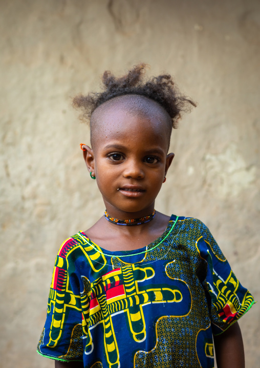 Portrait of a Peul tribe girl with a strange haircut, Savanes district, Boundiali, Ivory Coast