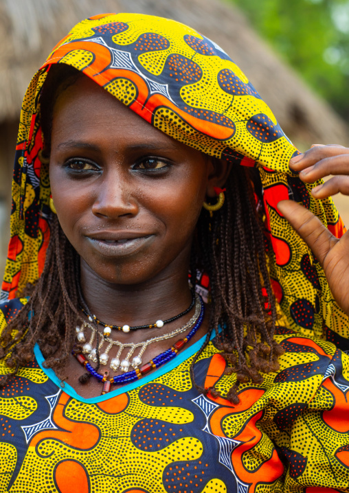 Portrait of a Peul tribe young woman with colorful clothes, Savanes district, Boundiali, Ivory Coast