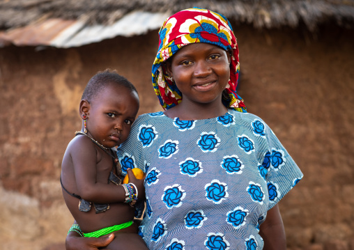 Portrait of a smiling Peul tribe mother with her child, Savanes district, Boundiali, Ivory Coast
