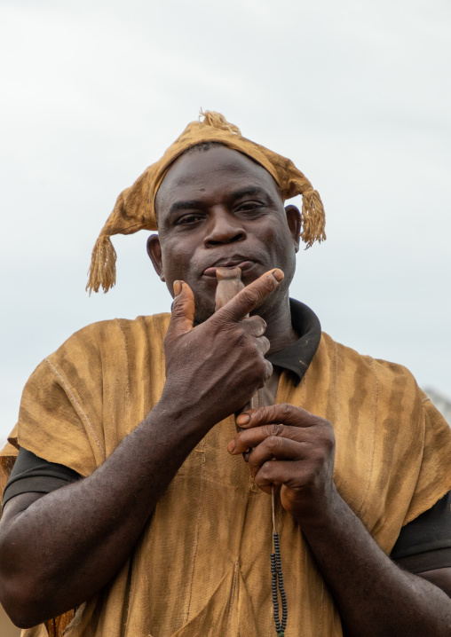 Senufo man using a flute during the Ngoro dance, Savanes district, Ndara, Ivory Coast