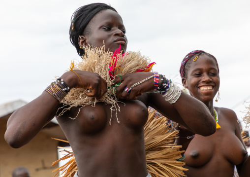 Young Senufo shirtless women dancing the Ngoro during a ceremony, Savanes district, Ndara, Ivory Coast