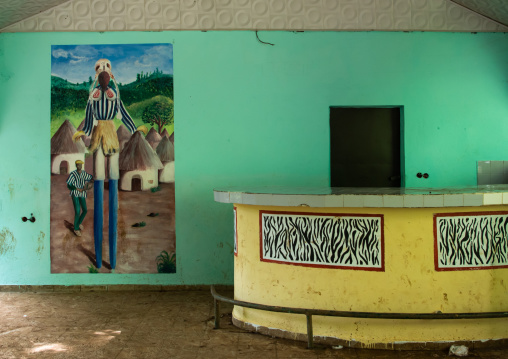 Empty bar decorated with a mural depitinf a Dan tribe masked dancer, Tonkpi Region, Man, Ivory Coast