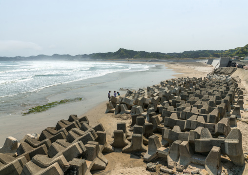 Japanese surfers in the contaminated area after the daiichi nuclear power plant irradiation, Fukushima prefecture, Tairatoyoma beach, Japan