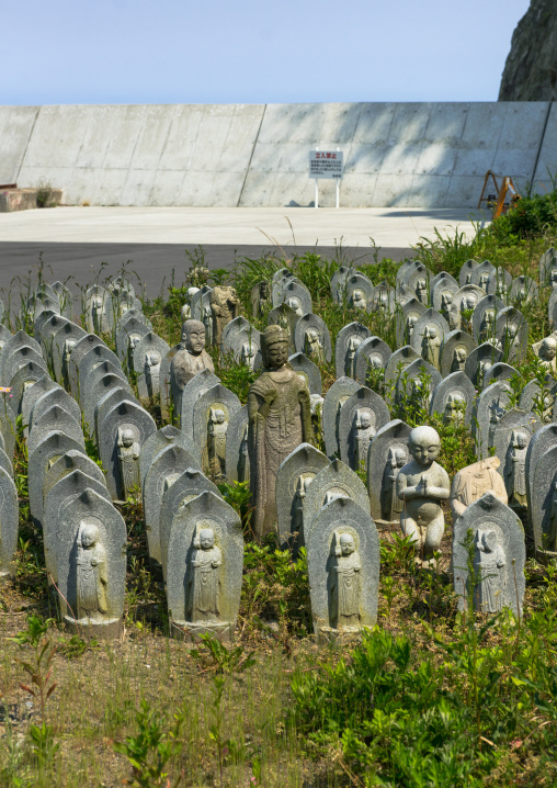 Stone baby statues called jizobosatsu protecting the souls of aborted children after the tsunami, Fukushima prefecture, Tairatoyoma beach, Japan