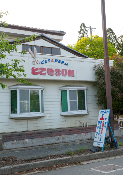 Diversion sign in front of an abandoned shop in the difficult-to-return zone after the daiichi nuclear power plant irradiation, Fukushima prefecture, Tomioka, Japan