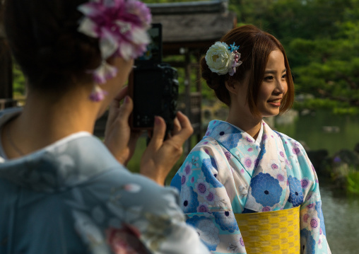 Chinese tourist women wearing geisha kimonos, Kansai region, Kyoto, Japan