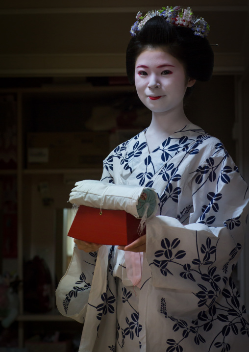 16 Years old maiko called chikasaya with the pillow shes uses to protect her hairstyle, Kansai region, Kyoto, Japan