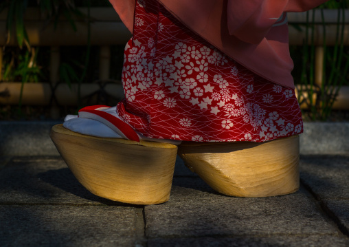 A maiko called chikasaya walking with her traditional maiko clogs, Kansai region, Kyoto, Japan